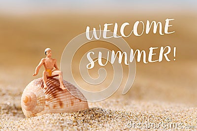 Miniature man in swimsuit and text welcome summer Stock Photo