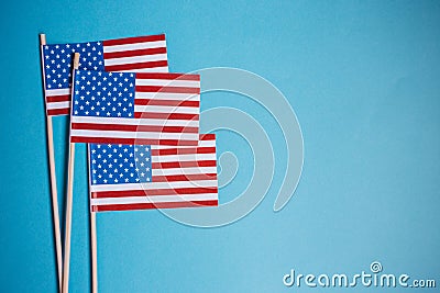 Miniature paper flags USA. American Flag on rustic wooden background Stock Photo