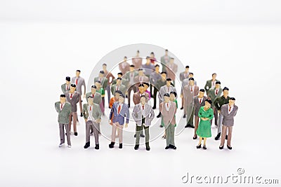 Miniature people business standing in crowd over white backdrop Stock Photo