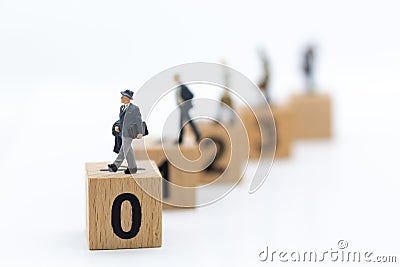 Miniature people: Businessman stand in order, ability of the person. Image use for work progress, business concept Stock Photo