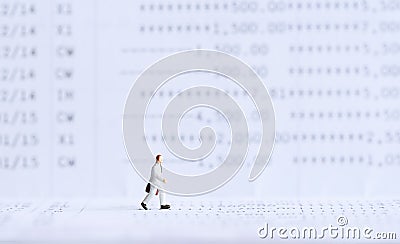 Businessman standing on bank passbook. Stock Photo