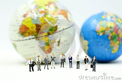 Miniature people : Businessman team with miniworld ,International business concept Stock Photo