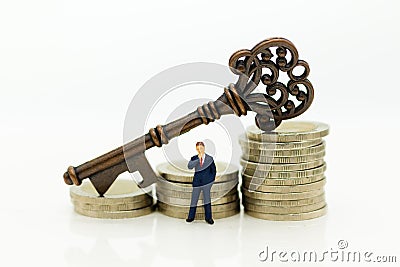 Miniature people: Businessmen stand with keys. Image use for key man, the key to success, business concept Stock Photo