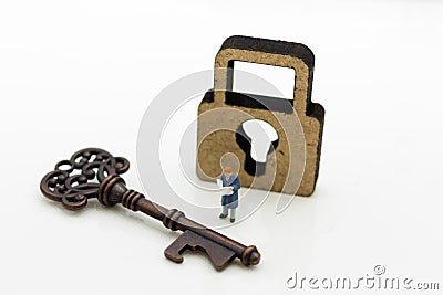 Miniature people: Businessmen stand with master key and reading newspaper. Image use for key man, the key to success, business Stock Photo