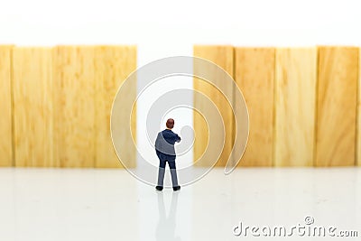 Miniature people : Businessmen are walking to the exit point. Image use for the best choice of choose, business concept Stock Photo