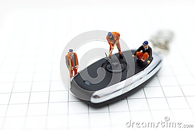 Miniature people : Car repair workers for return to use. Image use for maintenance, warranty, business concept Stock Photo