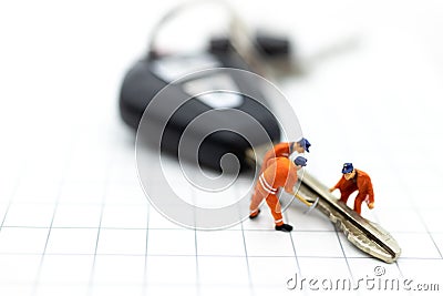 Miniature people : Car repair workers for return to use. Image use for maintenance, warranty, business concept Stock Photo