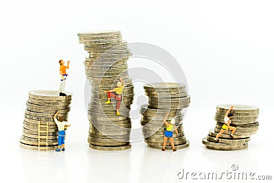 Miniature people: Climbers are climbing coins. Image use for moving forward to success, business concept Stock Photo