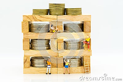 Miniature people: Climbers are climbing wooden block for keep money bank. Image use for business concept Stock Photo