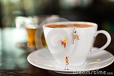 Miniature people : Coffee cup , image use for charge your energy in the morning Stock Photo