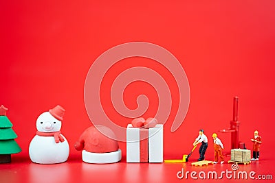 Miniature people creating Christmas decorations. Creative concept in Christmas Stock Photo