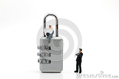 Miniature people are decrypting unlock padlock, Decrypt the key. concept for data security breach, risk and hacker attack Stock Photo