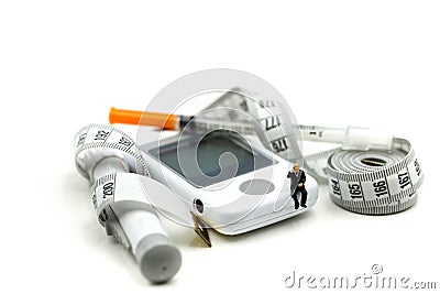 Miniature people : Doctor and patient with Glucose meter diabetes test and Syringe with measuring Stock Photo