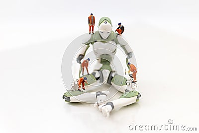 Miniature people : Engineering is developing an AI robot system, using labor instead of people. Image use for new technology in Stock Photo