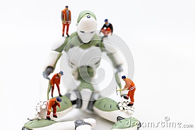 Miniature people : Engineering is developing an AI robot system, using labor instead of people. Image use for new technology in Stock Photo