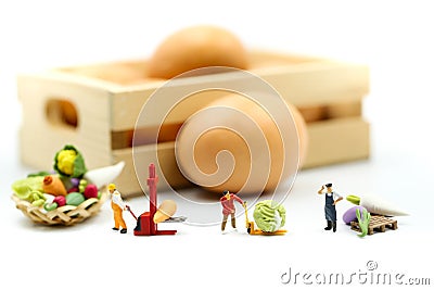 Miniature people : Farmer gardener in action with market,Farm Local Market Concept Stock Photo