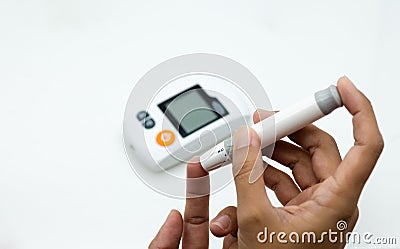 Miniature people: Glucose meter with lancet. Image use for medicine, diabetes, health care concept Stock Photo