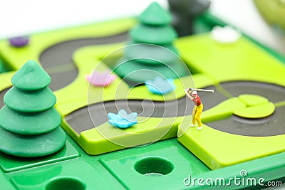 Miniature people : golfer stand with children`s toys collection, Stock Photo