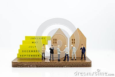 Miniature people: Group business meeting guaranteed loan, third party, guarantor. Image use for business concept. Stock Photo