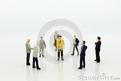 Miniature people: Group businessman negotiates business, planning. Image use for business concept Stock Photo