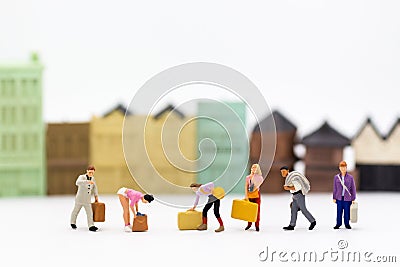 Miniature people: Group people carry a bag suitcase. Image use for business concept Stock Photo