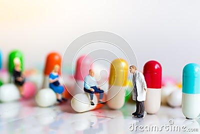 Miniature people: Group people queue up to wait for the doctor. Image use for Health check concept Stock Photo