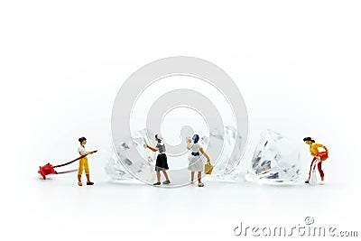 Miniature people : Maid or Housewife cleaning on diamond Stock Photo