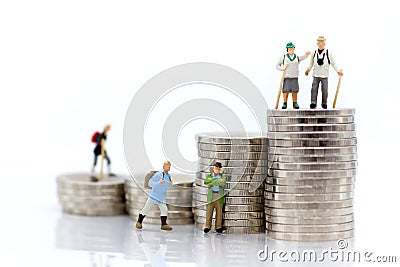 Miniature people: Old people standing on top of stack coins . Image use for background retirement planning, Life insurance concept Stock Photo