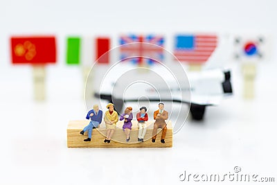 Miniature people: passenger waiting plane for go to destination, transportation. Image use for business background concept Stock Photo
