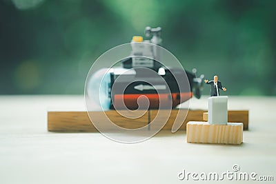 Miniature people of a politician stand on podium during a public speaking of submarine Stock Photo