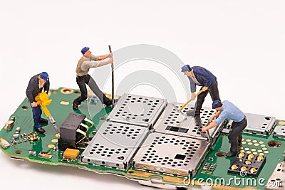Miniature people repair electronic device Stock Photo