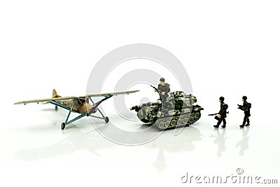 Miniature people : team soldier standing together with army tan Stock Photo