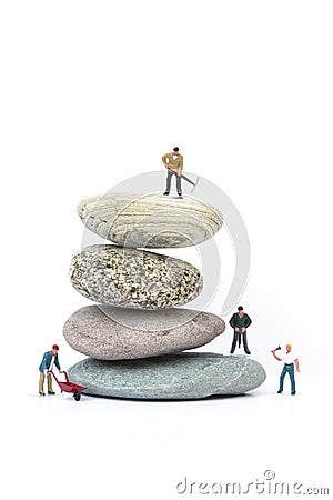 Miniature people teamwork overcoming obstacles business concept Stock Photo