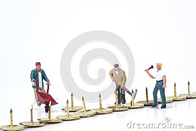 Miniature people teamwork overcoming obstacles business concept Stock Photo