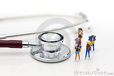 Miniature people: Travelers with pre-departure health check-ups. Image use for healthy , travel concept. Stock Photo