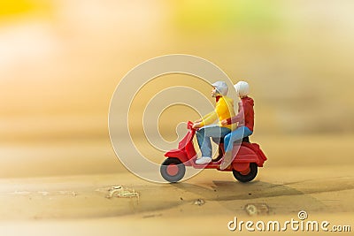 Miniature people : Travelers riding motorcycle on the road using Stock Photo