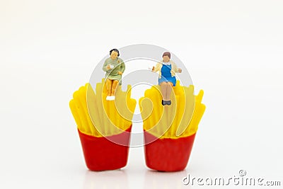 Miniature people : Woman sitting on junkfood. Image use for healthcare and diet concept Stock Photo