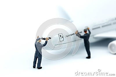 Miniature people : worker or Housewife cleaning on air plane us Stock Photo