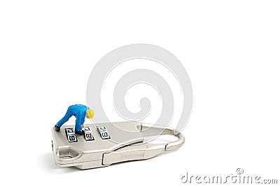 Miniature people worker : Teamwork helps to unlock password on the keys. Stock Photo