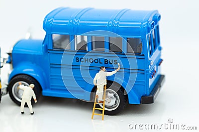 Miniature people : Workers make up the car. Image use for cleaning and maintenance, business autocar concept Stock Photo