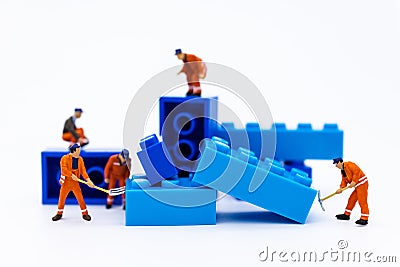 Miniature people : Workers are repairing, arranging components for construction work. Use images for construction business Stock Photo