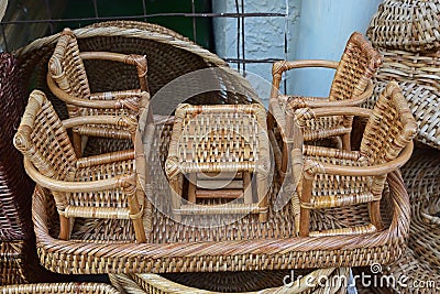 Miniature Rattan Set of single Coffee Table and four comfortable chairs Stock Photo