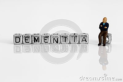 Miniature scale model pensioner with the word dementia Stock Photo