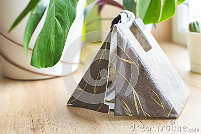 Miniature of a tent made of cotton. Hobby, sewing eco friendly toys. Camping. Stock Photo