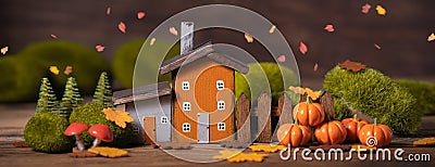 Miniature Thanksgiving little autumn cottages village in the forest, banner Stock Photo