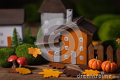 Miniature Thanksgiving little autumn cottages village in the forest Stock Photo