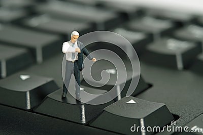 A businessman getting ready wearing suit standing above keyboard. Stock Photo