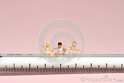 Group of boy toddler infant baby seat above needle syringe whimpering Stock Photo