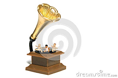 Music for brain development. A group of toddlers seat above vintage antique gramaphone vinyl. Stock Photo