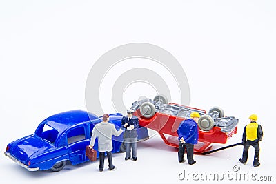 Miniature tiny toys car crash accident damaged.Insurance on the Stock Photo